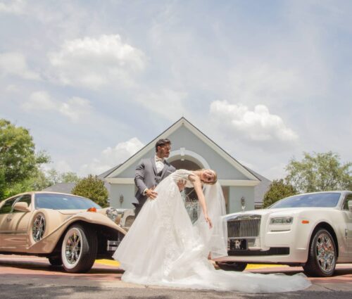 Bride and Groom in front of Exotic Limo Orlando's Rolls Royce Ghost and Excalibur Godfather.
