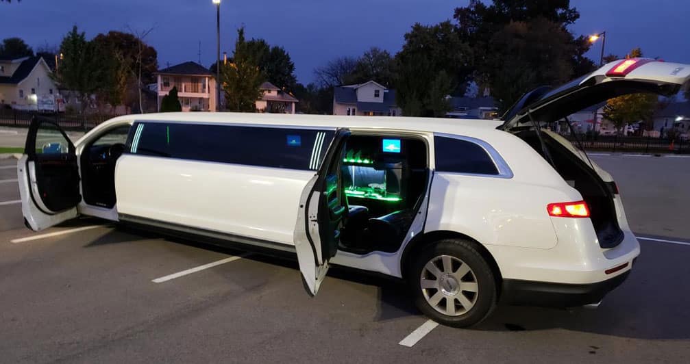 Lincoln MKT Limo White with doors and trunk open.