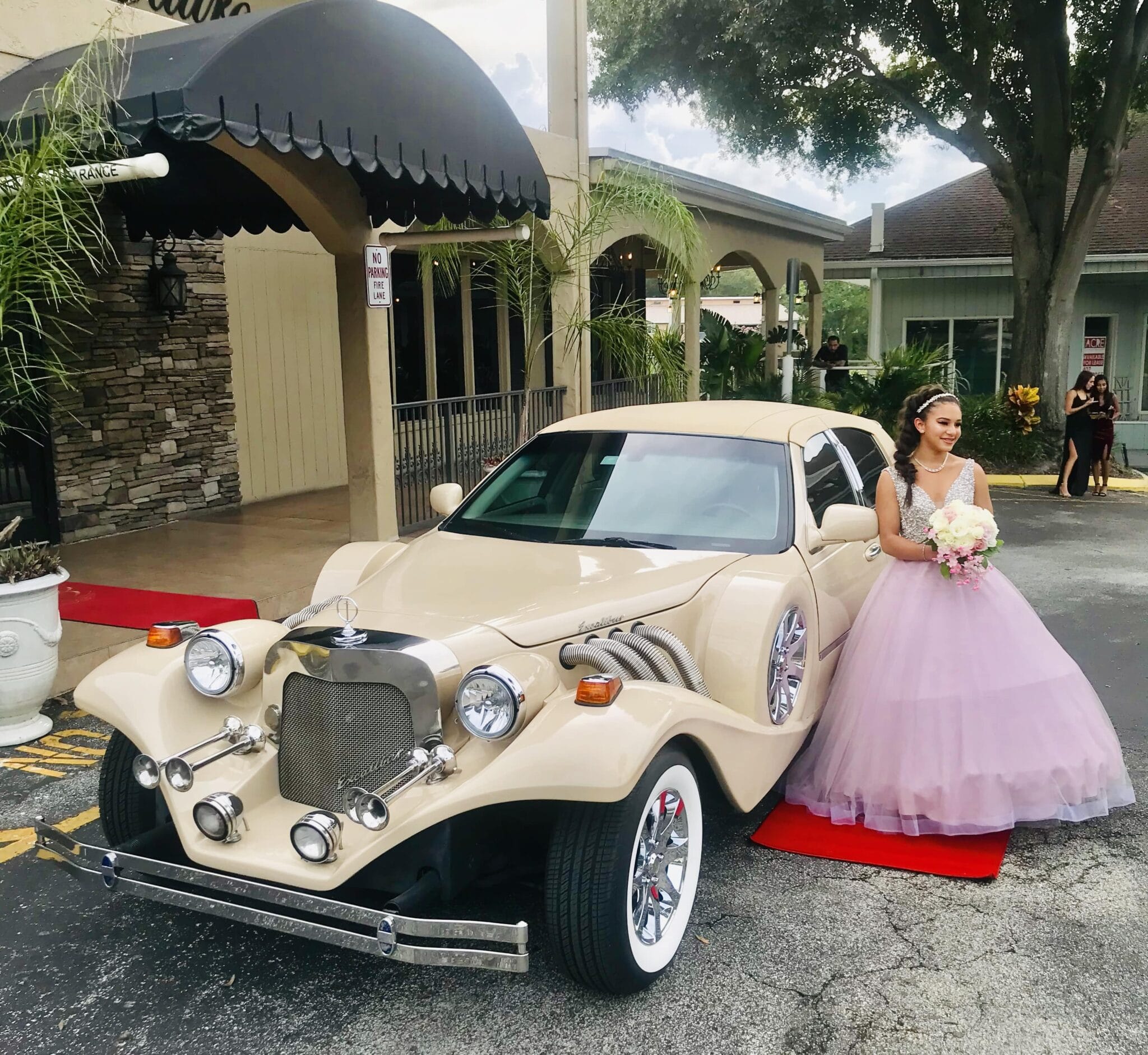 A young girl stands by the Excalibur Godfather from Exotic Limo before her celebration.