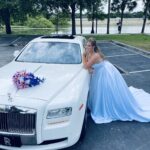 Bride poses with the Rolls Royce Ghost