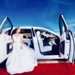 Bride steps out of the Rolls Royce Ghost and onto Exotic Limo red carpet.